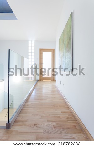 Interior of a contemporary corridor with glass banister