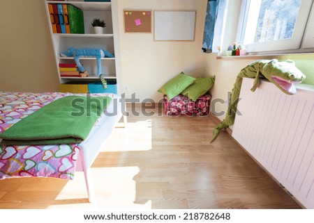 Colorful and bright kids bedroom from the inside