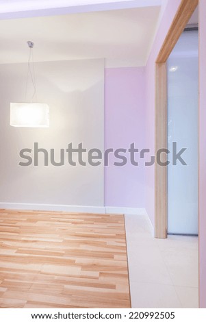 Big bright empty room with violet walls