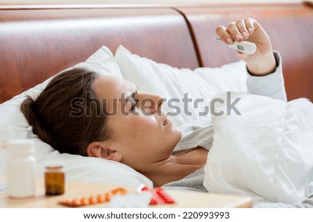 View of sick woman with a fever