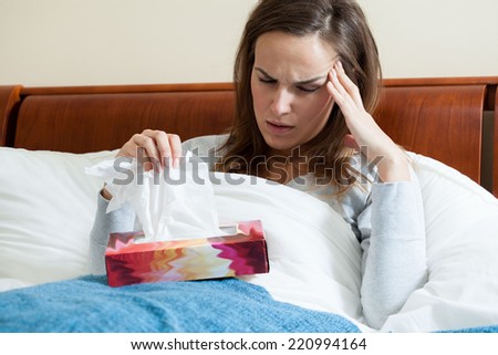 Horizontal view of ill woman feeling pain
