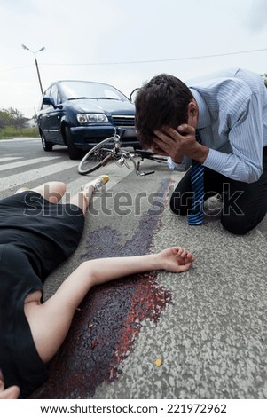 Bleeding woman on the pedestrian crossing, vertical