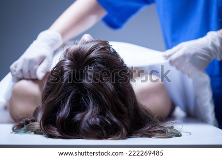 View of nurse covering the dead body