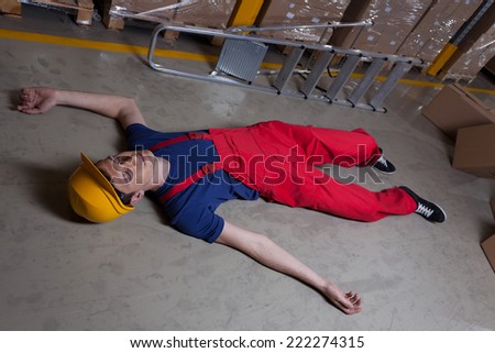 Unconscious man on the floor in a factory