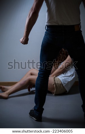 Aggressive men standing over his victim