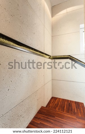 Vertical view of wooden stairs in modern house