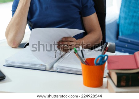 Young boy studying at home before hard exam