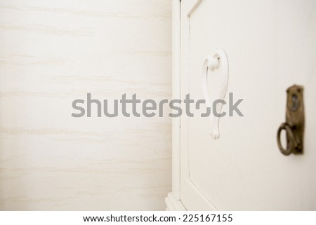 Horizontal view of close-up of white door