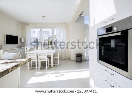 Open kitchen and dinning room in luxury villa