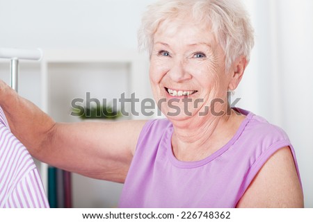 Portrait of smiling elderly woman with gray hair