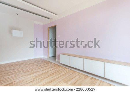 Spacious empty room in pastel colors and dropped ceiling