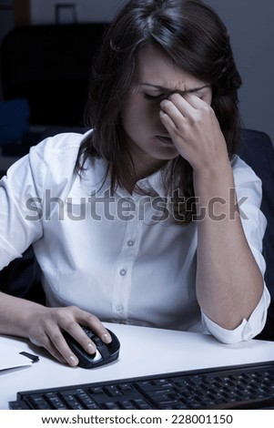 Vertical view of young businesswoman feeling sick