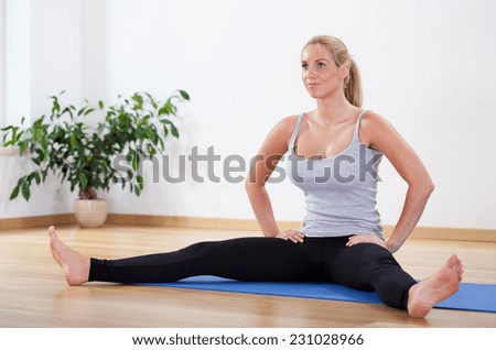 Woman stretching her body after morning training