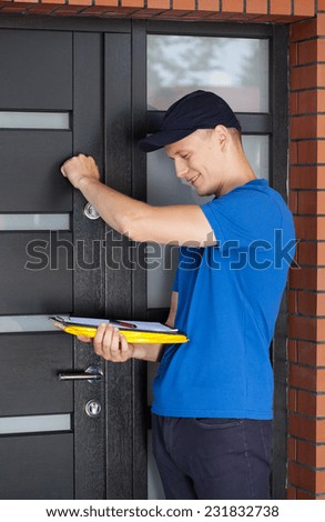 Delivery man with clipboard knocking on door