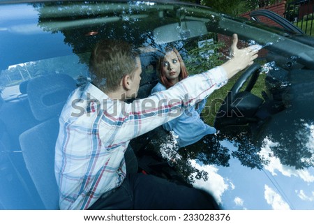 Man shouting at female driver in a car