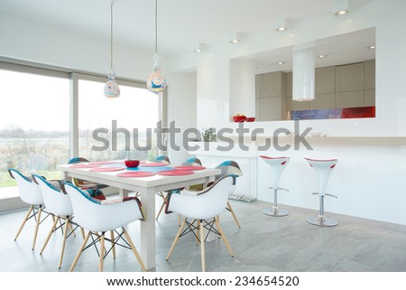 Modern dining room interior with color elements