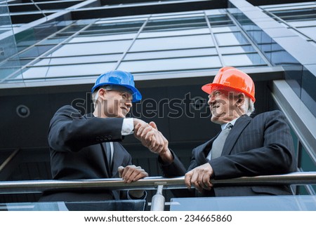 Agreement between two experienced workers in suits
