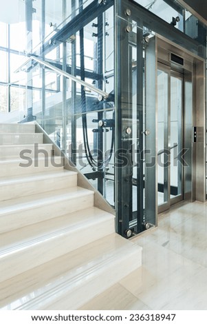 Glass elevator in the modern business office