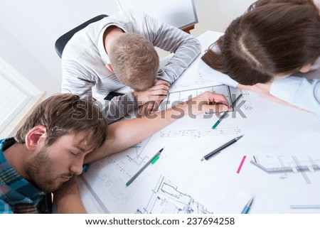 Exhausted architects fell asleep while working