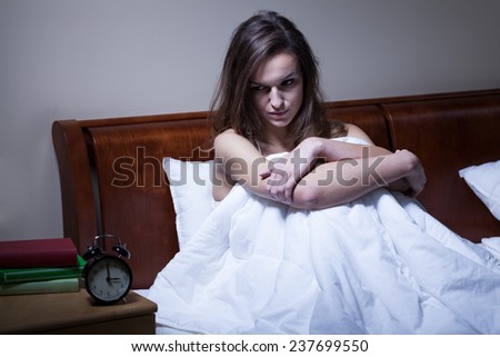 Woman waked up at 3 a.m sitting on the bed
