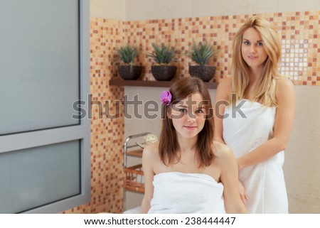 Two beautiful women in towels at spa