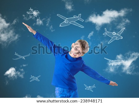 Little happy boy trying to fly like an airplane