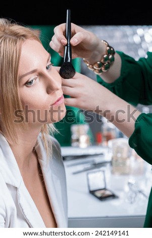 Make up artist doing makeup test before wedding