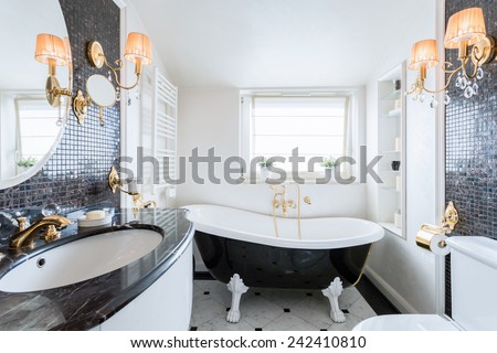 Interior of black and white baroque bathroom