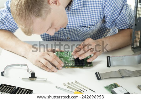 Close-up of computer science working in his office