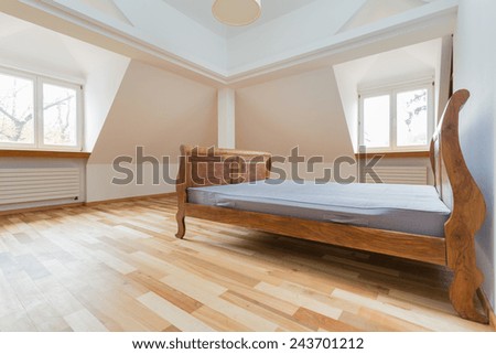 Empty room interior with old fashioned bed