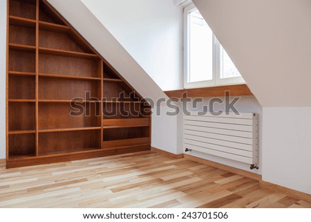 View of empty bookshelf in the attic