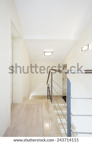 Bright corridor upstairs in new house, vertical