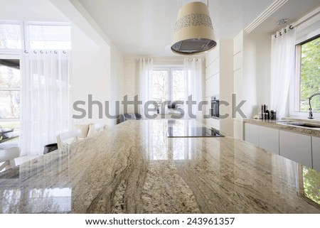 Granite worktop inside white light apartment