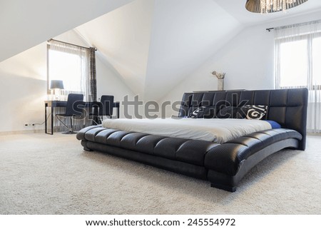 View of designed bed in modern bedroom