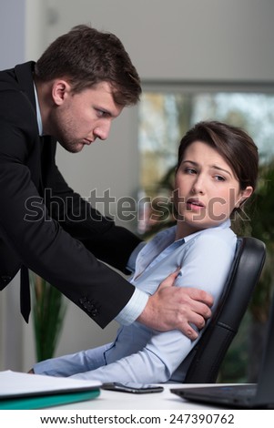 Young woman being victim of bullying in the workplace