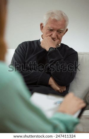 Senior man with depression during visit in psychiatrist
