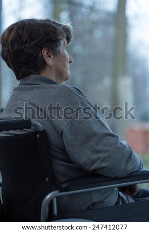 Image of older injured woman sitting on a wheelchair