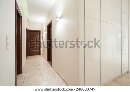 View of long anteroom inside bright apartment
