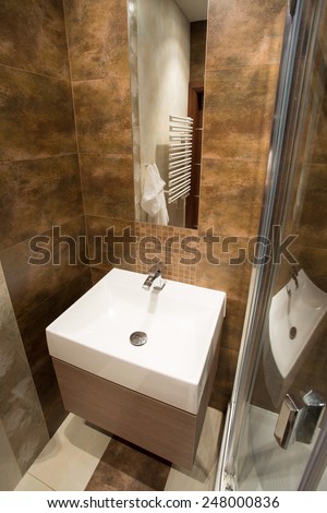 View of porcelain sink inside small bathroom