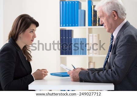 Young pretty afraid woman on her job interview