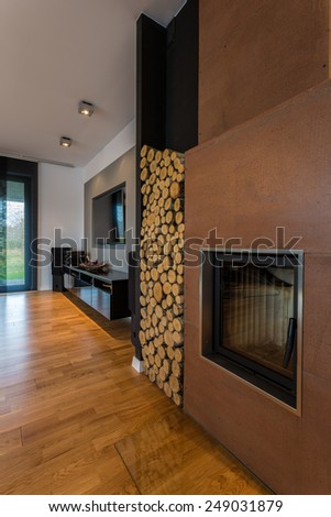 Big fireplace in new living room with wooden floor