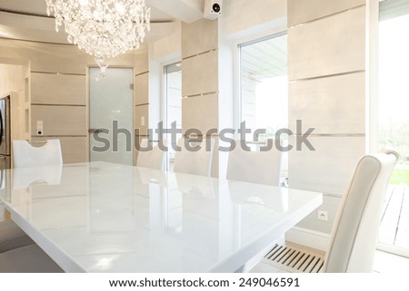 Cristal chandelier in bright dining room interior