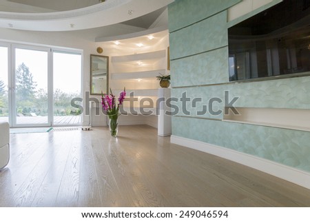 Vase with flowers in drawing room in pastel colors