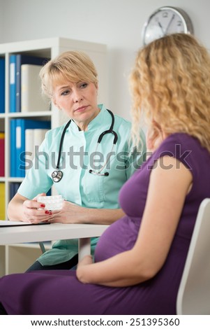 Young pregnant woman on her check up at doctor\'s office