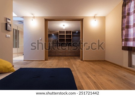 Large bedroom with wardrobe in the apartment