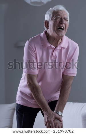Retired man suffering for terrible pain of the knee