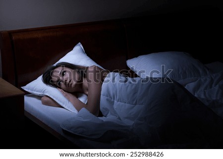 Woman suffering from depression at night, horizontal