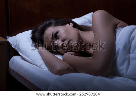 View of woman can\'t sleep during night