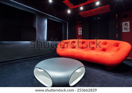 View of red sofa at home cinema