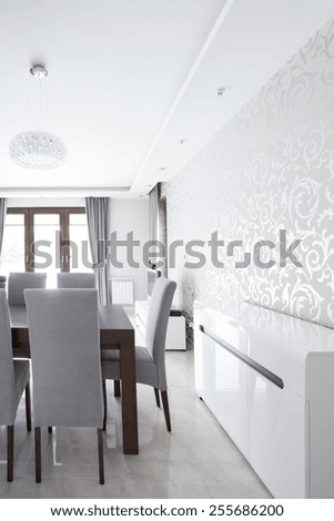 Silver wallpaper in elegant dining room interior